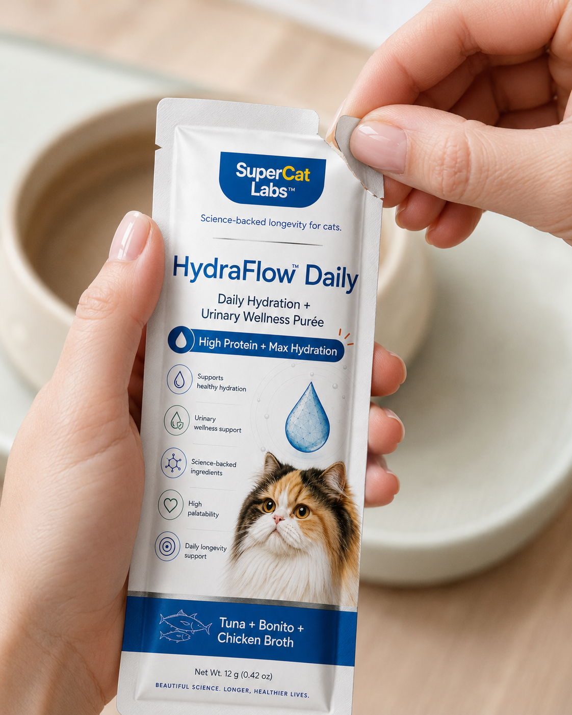 Hand opening a HydraFlow Daily sachet